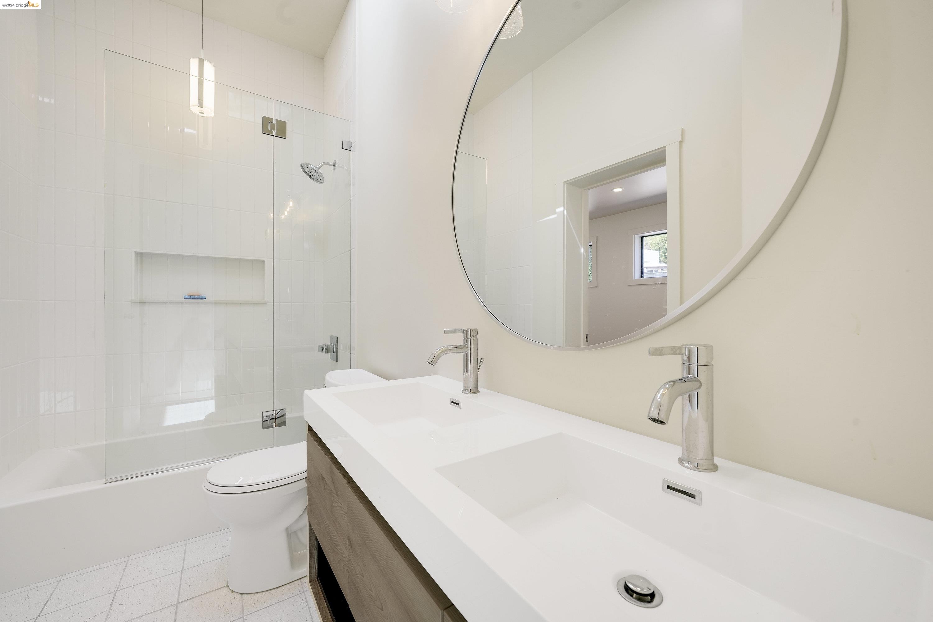 921 Clark Place El Cerrito, CA 94530 - Photo 14 of 36 a bathroom with a sink a toilet and shower