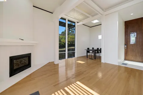 a view of livingroom with hardwood floor and a fireplace