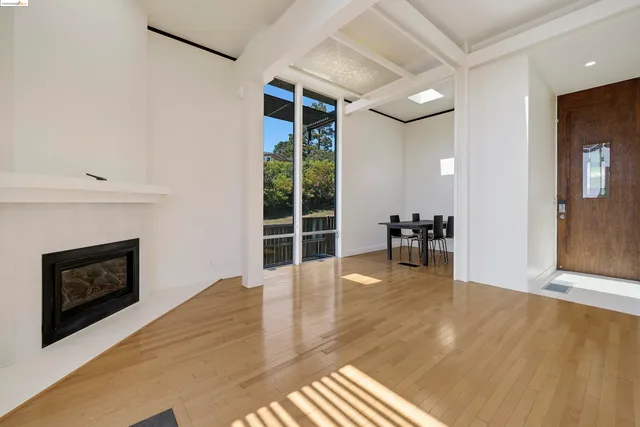 a view of livingroom with hardwood floor and a fireplace