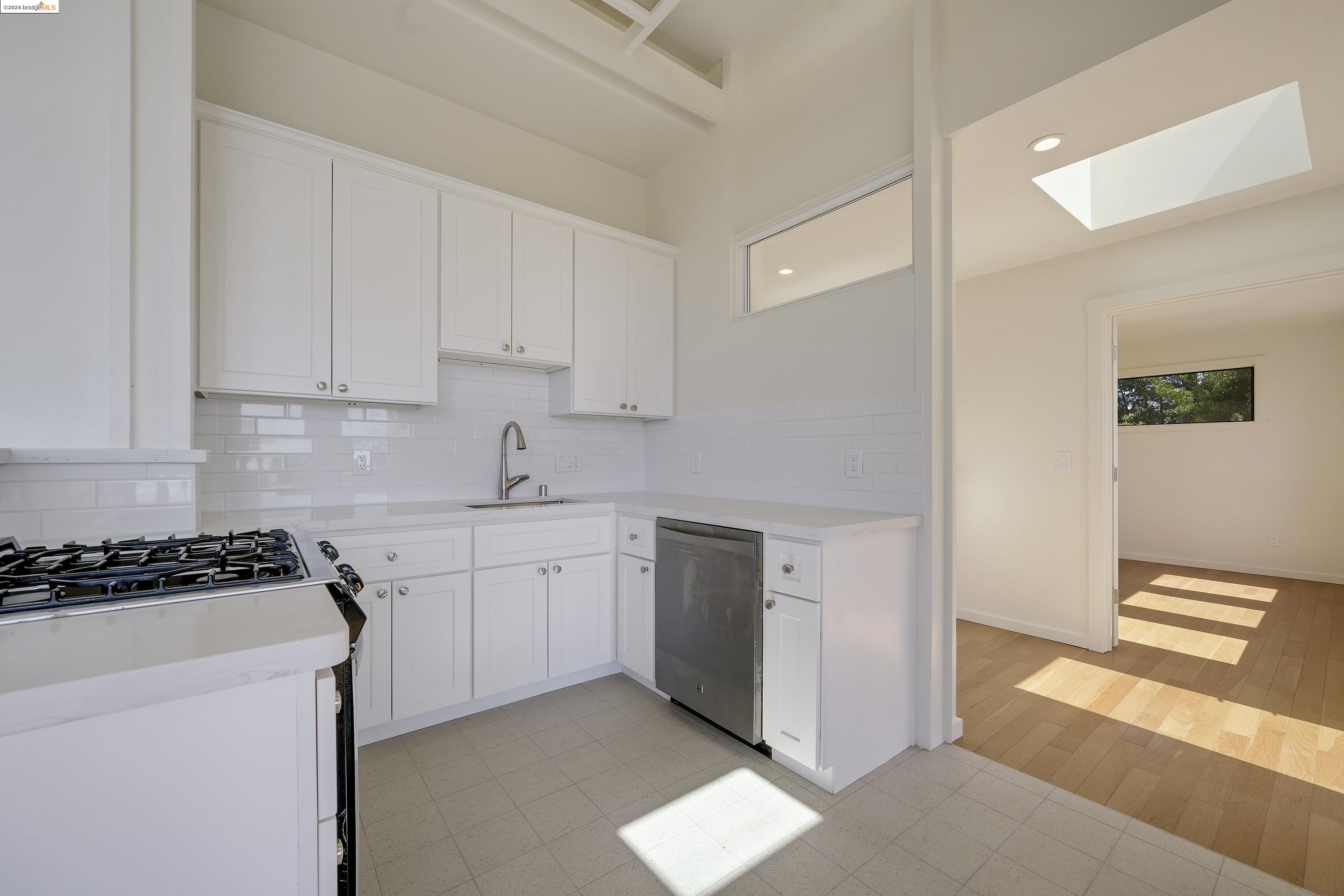 921 Clark Place El Cerrito, CA 94530 - Photo 22 of 36 a kitchen with stainless steel appliances granite countertop a stove a sink and a refrigerator