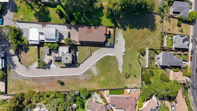an aerial view of a house with a swimming pool
