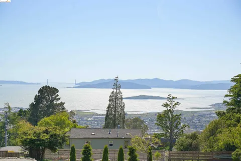 a view of lake with mountain in the background