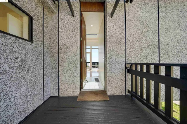 a view of a balcony with wooden floor