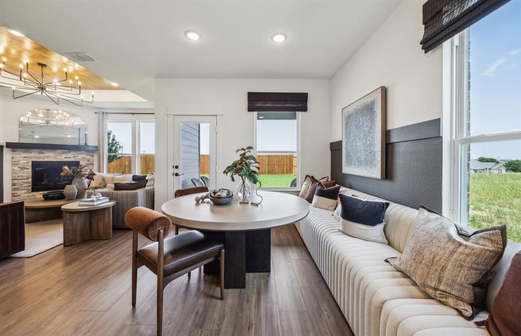 5916 Hodgkin Avenue Pilot Point, TX 76258 - Photo 6 of 24 a living room with furniture kitchen view and a large window