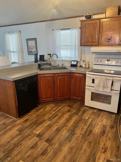 215 South Valley View Road, Unit 34 Donna, TX 78537 - Photo 12 of 24 a kitchen with stainless steel appliances granite countertop a stove a sink and a microwave