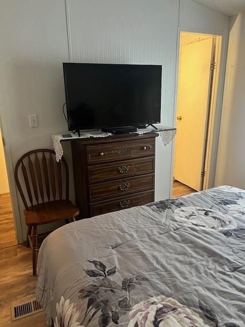 215 South Valley View Road, Unit 34 Donna, TX 78537 - Photo 14 of 24 a bedroom with a bed and a flat screen tv