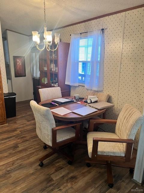 215 South Valley View Road, Unit 34 Donna, TX 78537 - Photo 10 of 24 a dining room with wooden floor a chandelier a wooden table and chairs