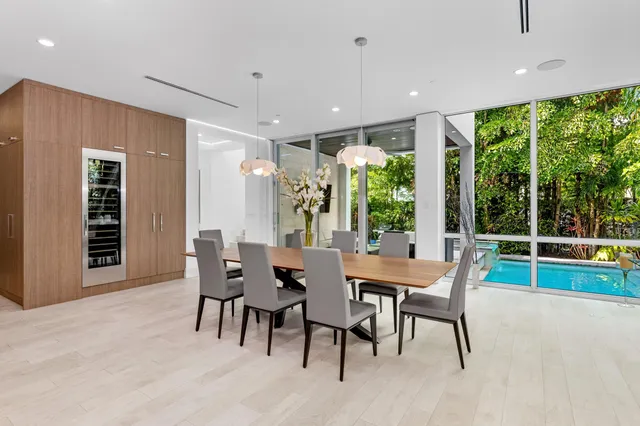 a dining room with furniture window and outside view