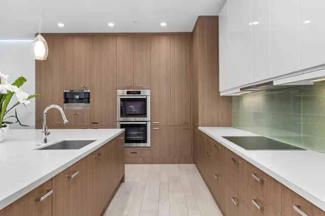 a kitchen with a sink and a refrigerator