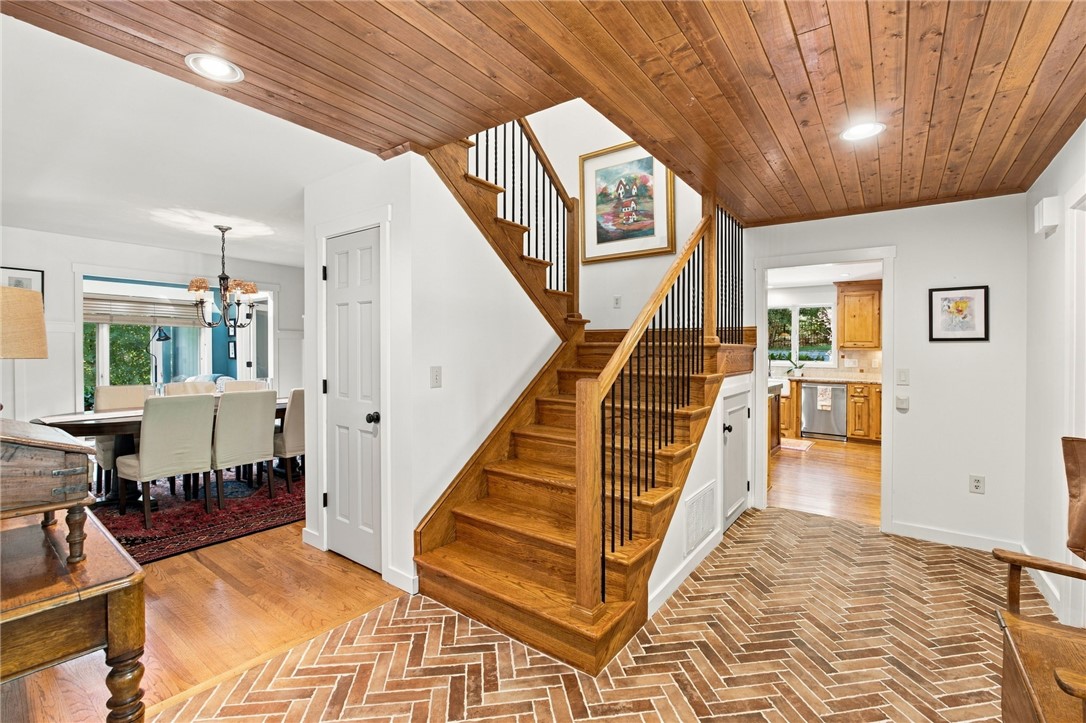 604 Ridgecrest Drive Clemson, SC 29631 - Photo 10 of 50 Rich wood plank ceilings and herringbone brick flooring frame this inviting multi-level entryway.