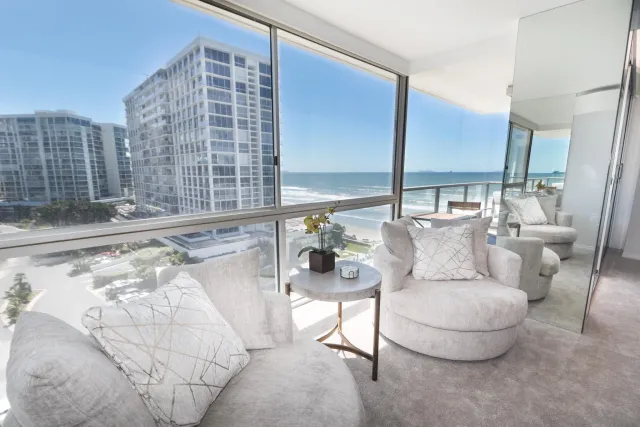 a living room with furniture and a rug