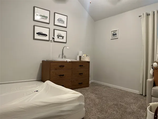 a bathroom with a bathtub and a window