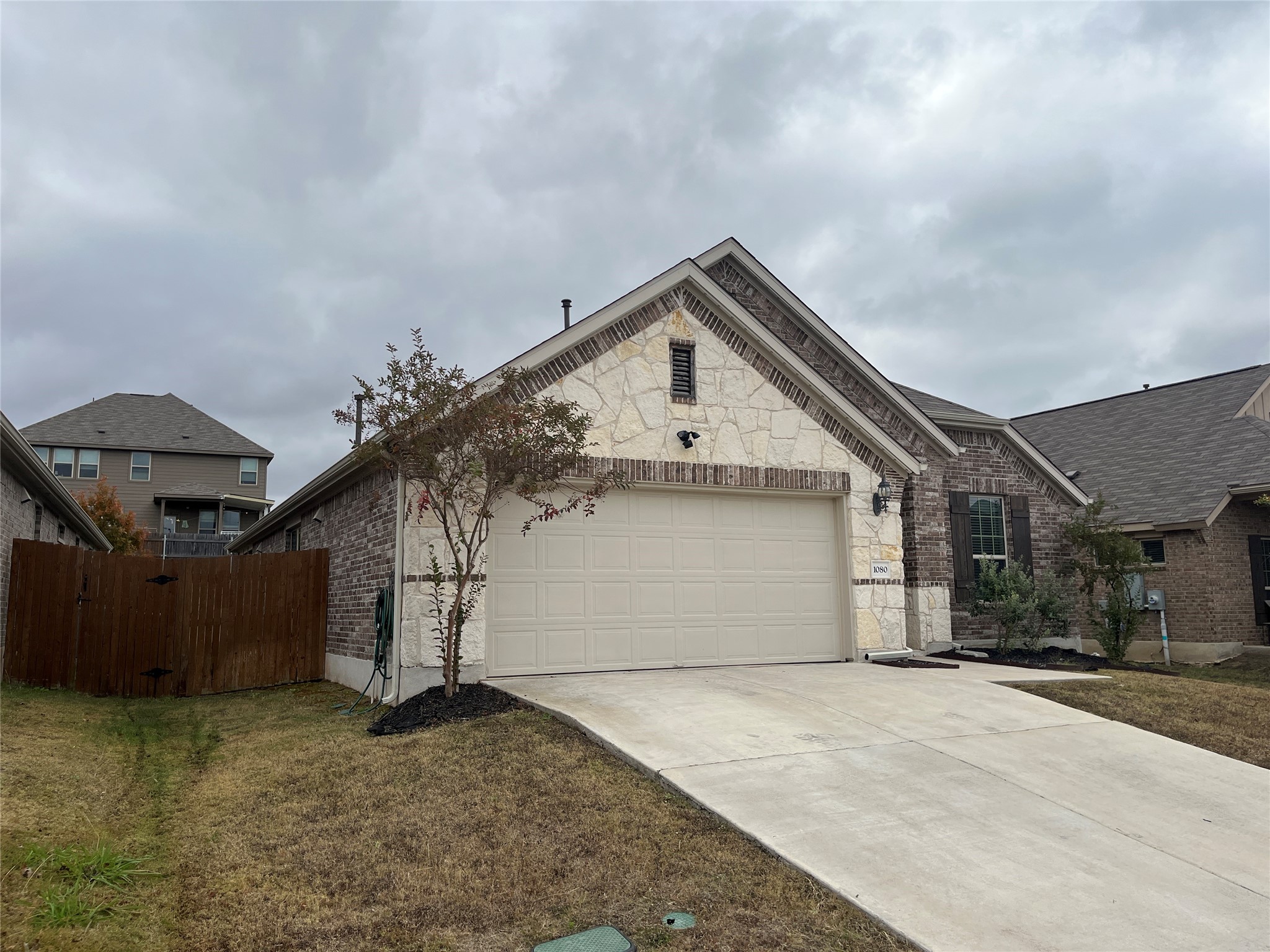 1080 Leadtree Loop Buda, TX 78610 - Photo 25 of 25 a view of a house with a backyard