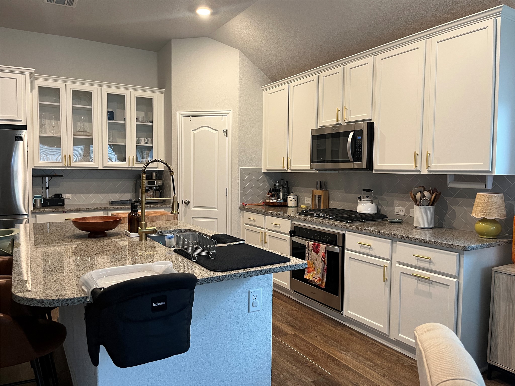 1080 Leadtree Loop Buda, TX 78610 - Photo 3 of 25 a kitchen with a sink stove and microwave