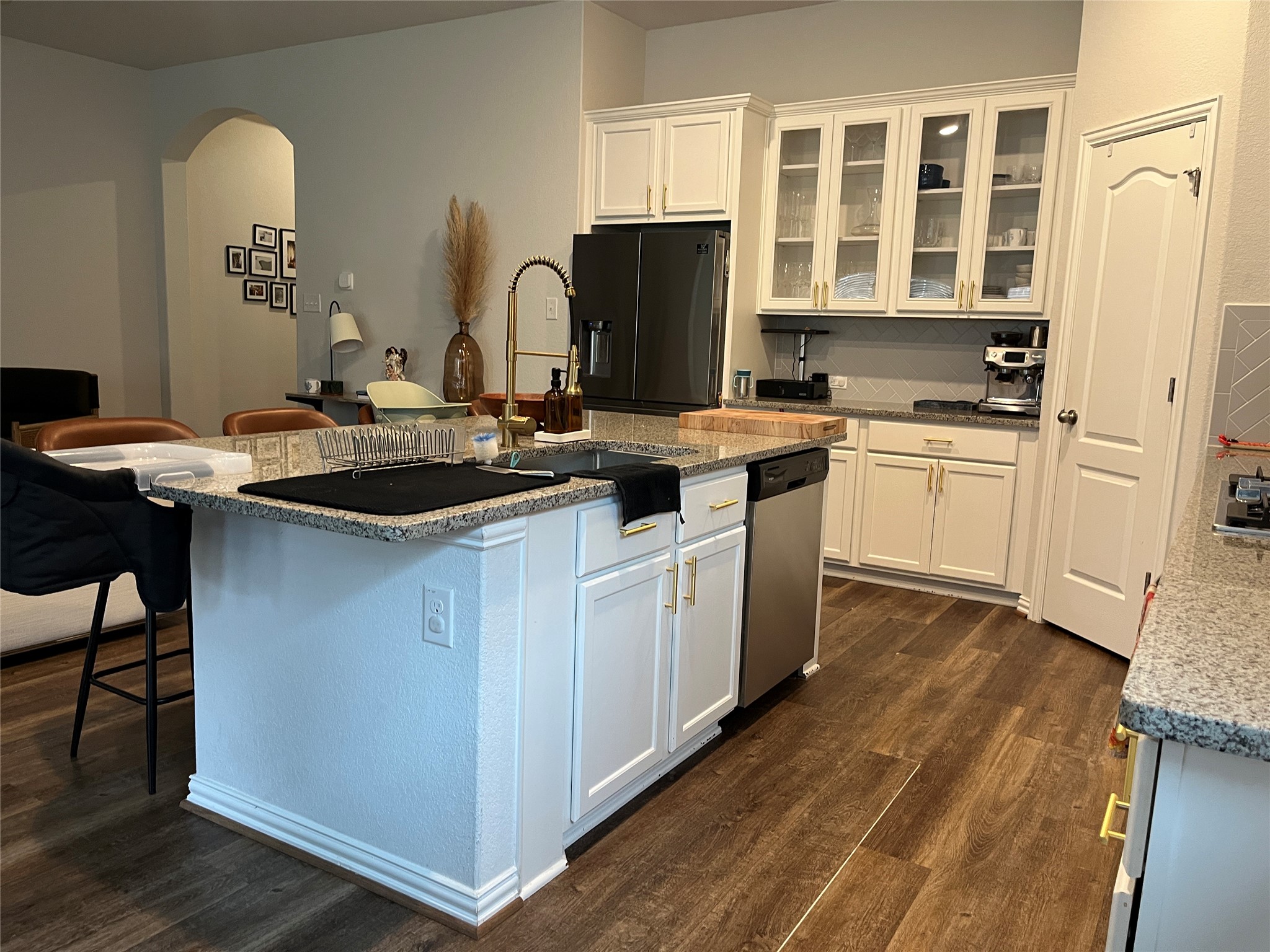 1080 Leadtree Loop Buda, TX 78610 - Photo 4 of 25 a kitchen with a sink stove and cabinets