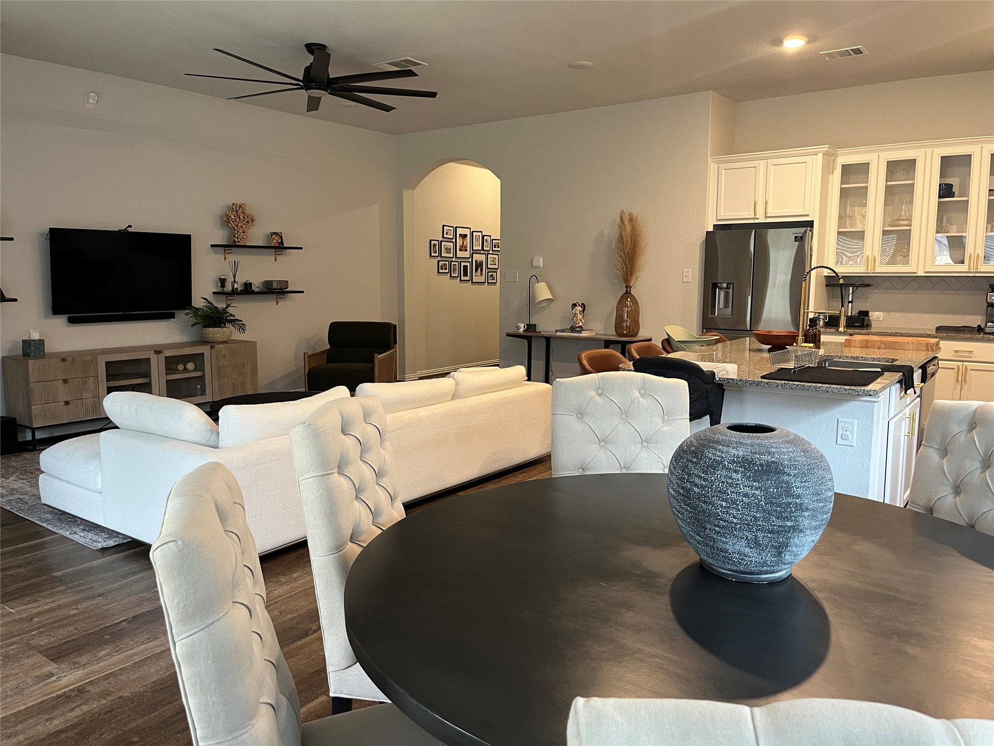 1080 Leadtree Loop Buda, TX 78610 - Photo 9 of 25 a living room with furniture a flat screen tv and a large window