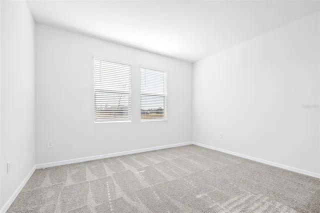 a view of water heater room with a fireplace