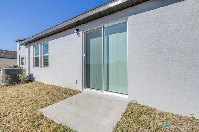 a view of swimming pool with outdoor seating and yard
