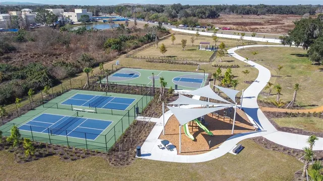 a view of swimming pool with outdoor seating and plants