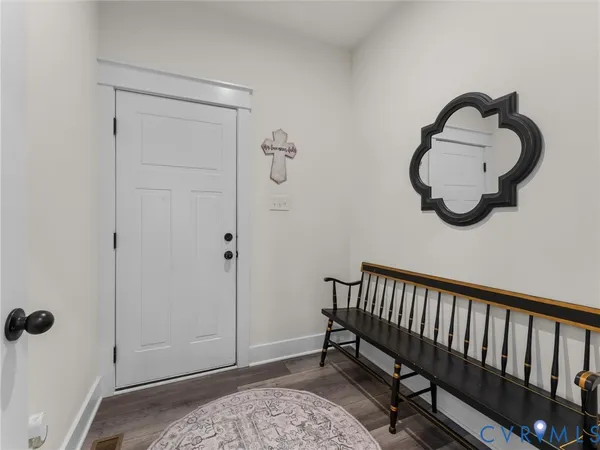 a spacious bedroom with a bed and a flat screen tv