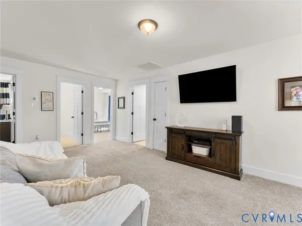 a bed room with a bed and a mirror