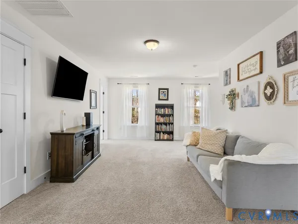 a bathroom with a double vanity sink mirror and shower