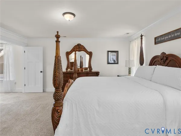 a bedroom with a bed and a table in it