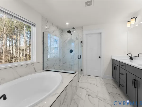 a bedroom with a bed and a view of bathroom