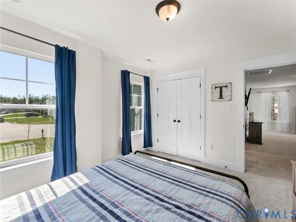 a living room with a bed and furniture