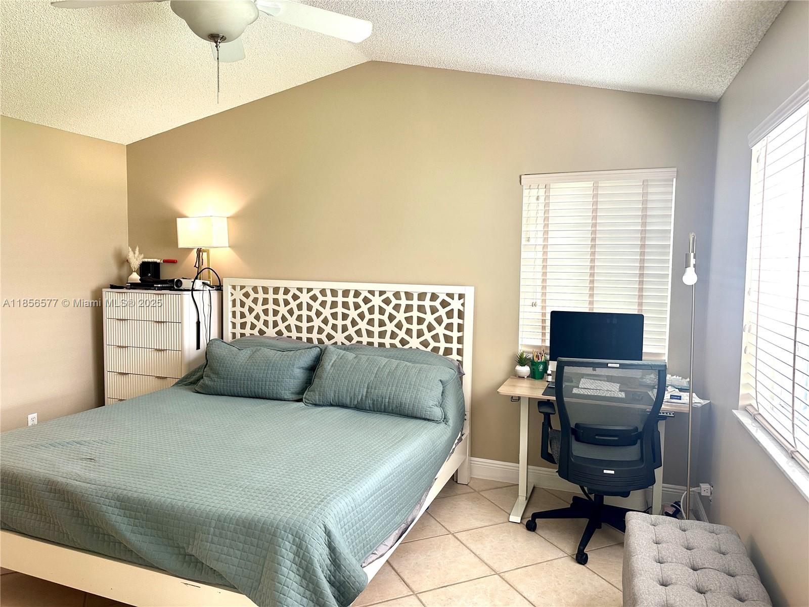 4370 Pine Ridge Court Weston, FL 33331 - Photo 14 of 39 a bedroom with a bed and furniture