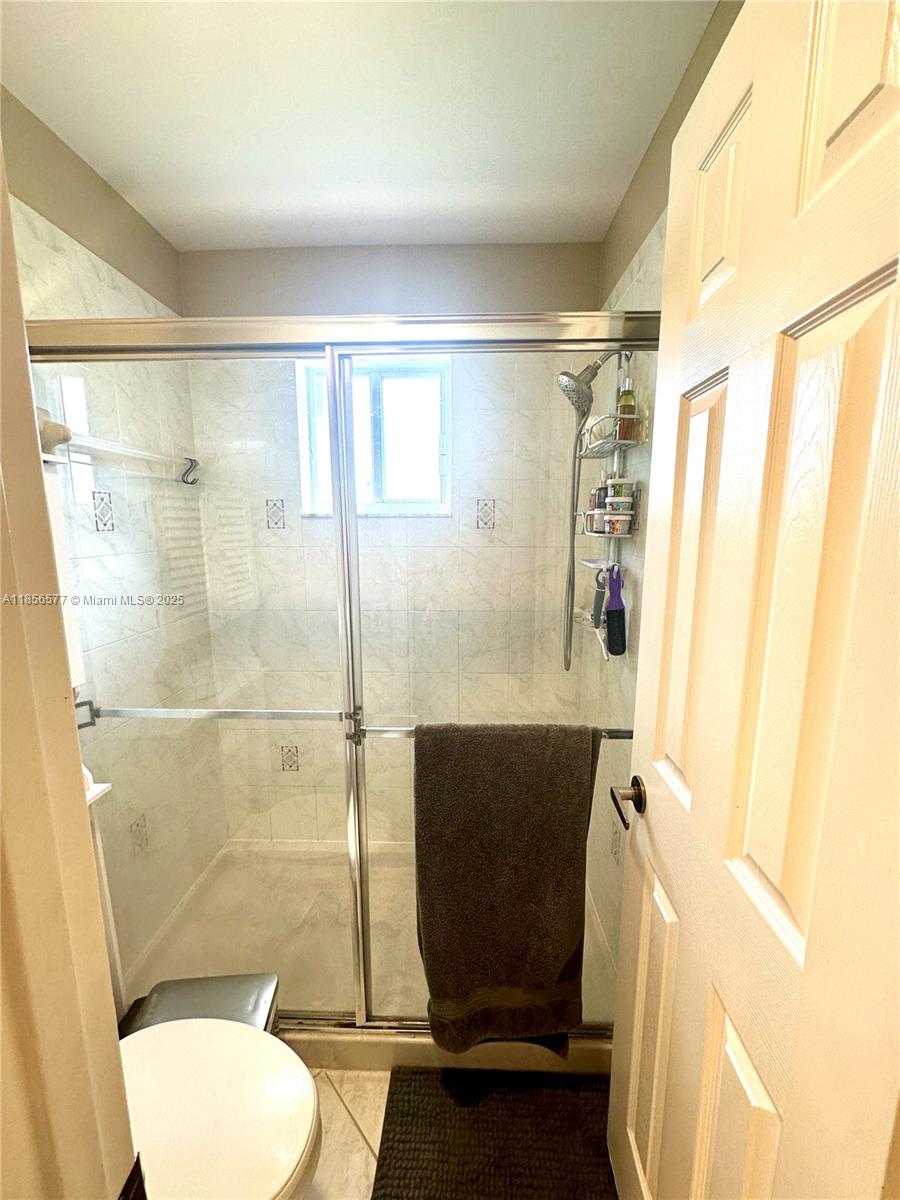 4370 Pine Ridge Court Weston, FL 33331 - Photo 16 of 39 a bathroom with a toilet and a shower