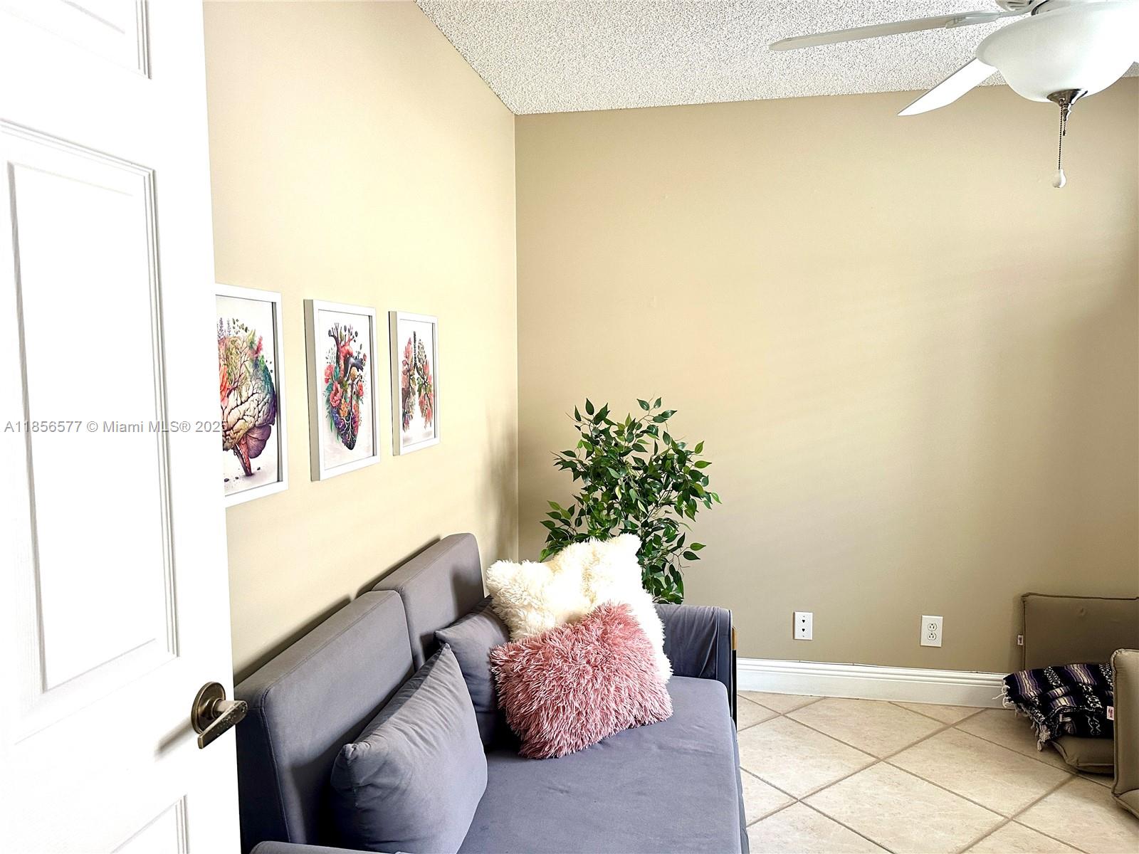 4370 Pine Ridge Court Weston, FL 33331 - Photo 21 of 39 a living room with furniture and a potted plant