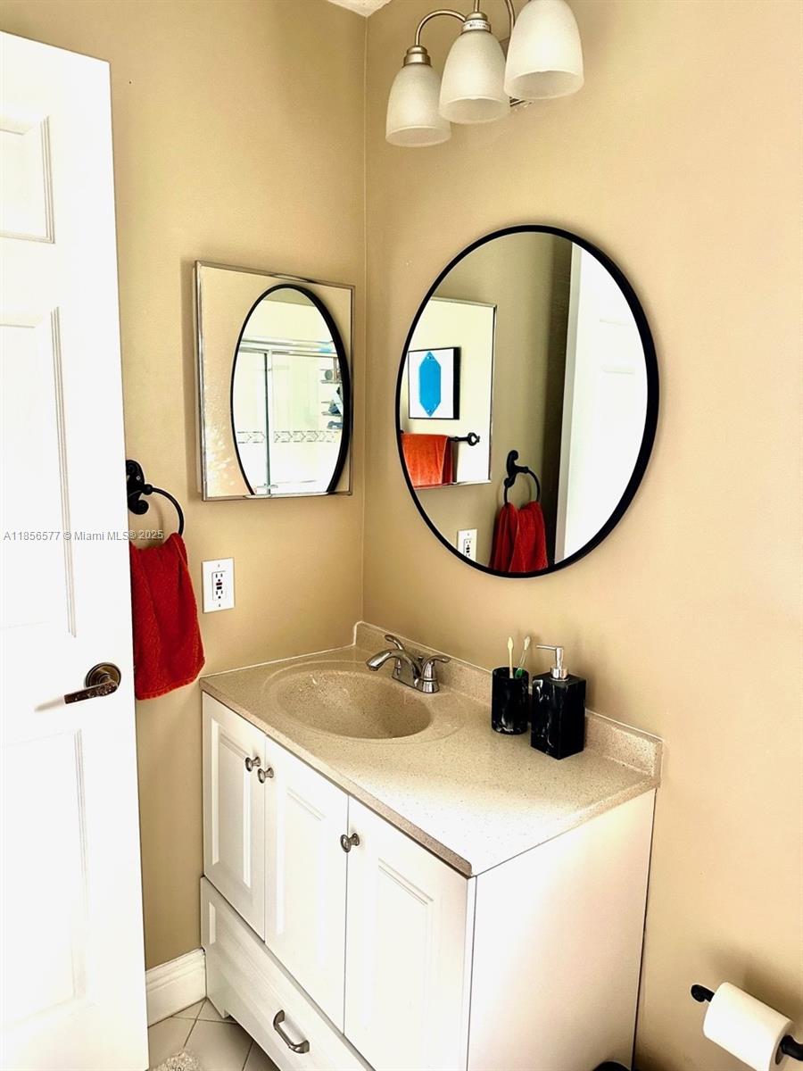 4370 Pine Ridge Court Weston, FL 33331 - Photo 24 of 39 a bathroom with a sink and a mirror