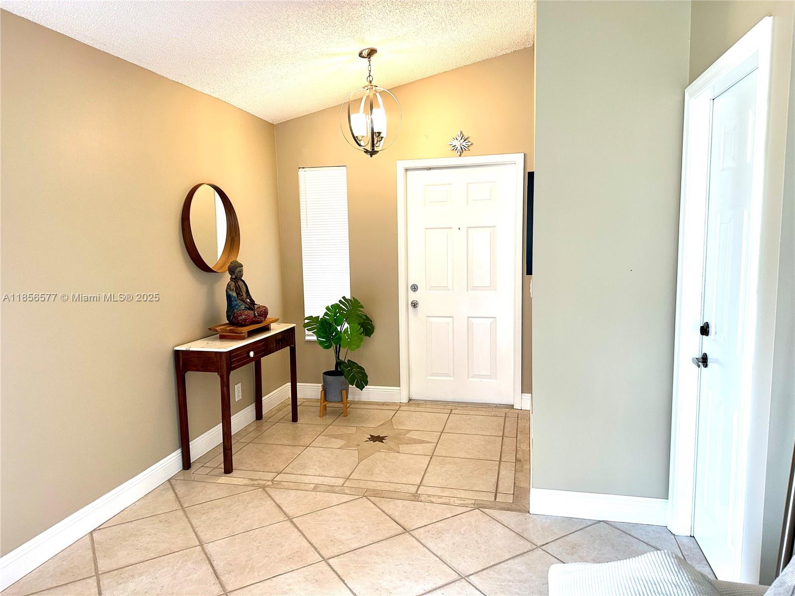 4370 Pine Ridge Court Weston, FL 33331 - Photo 4 of 39 a view of a room with furniture and a window