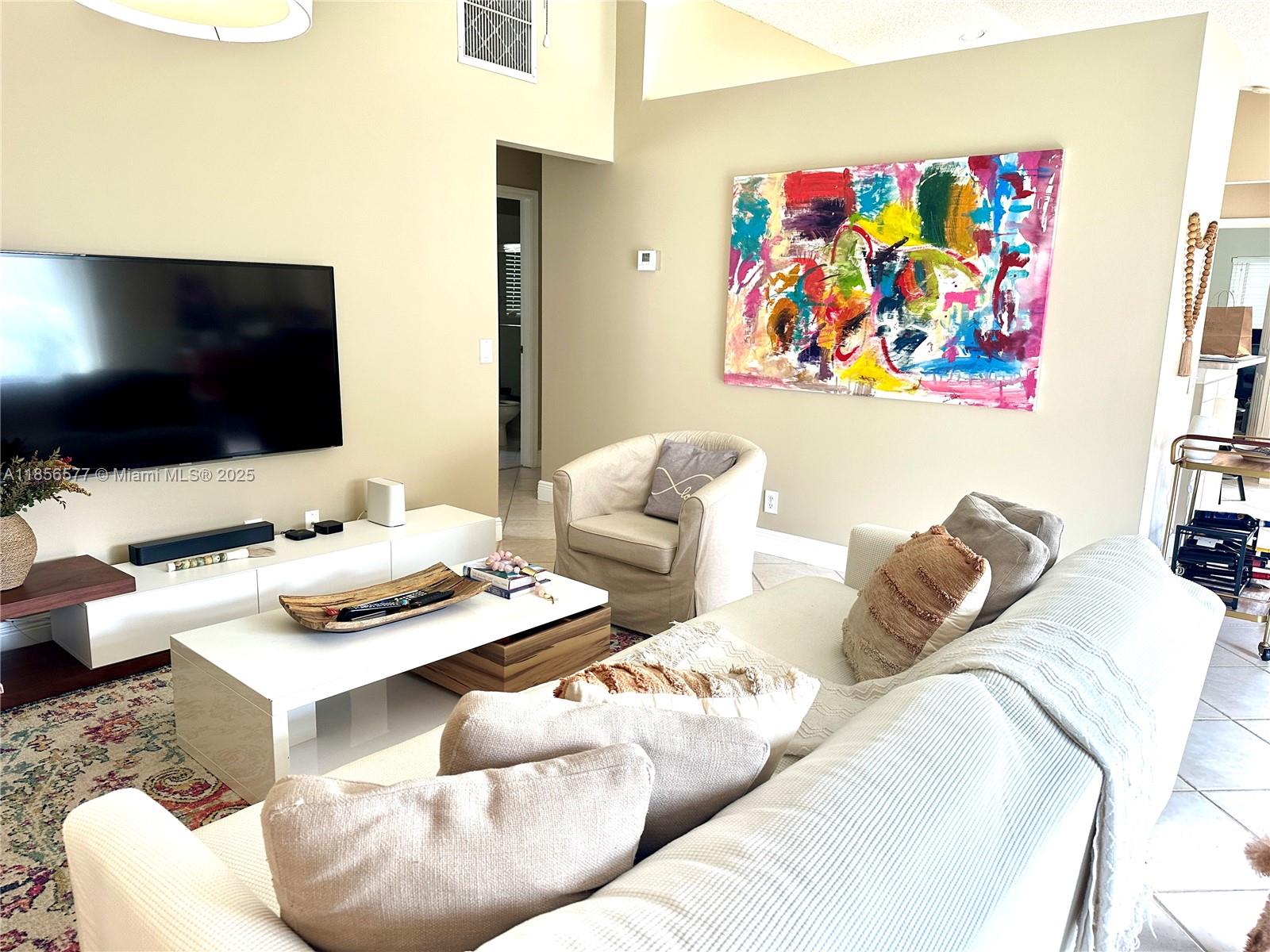 4370 Pine Ridge Court Weston, FL 33331 - Photo 5 of 39 a living room with furniture and a flat screen tv