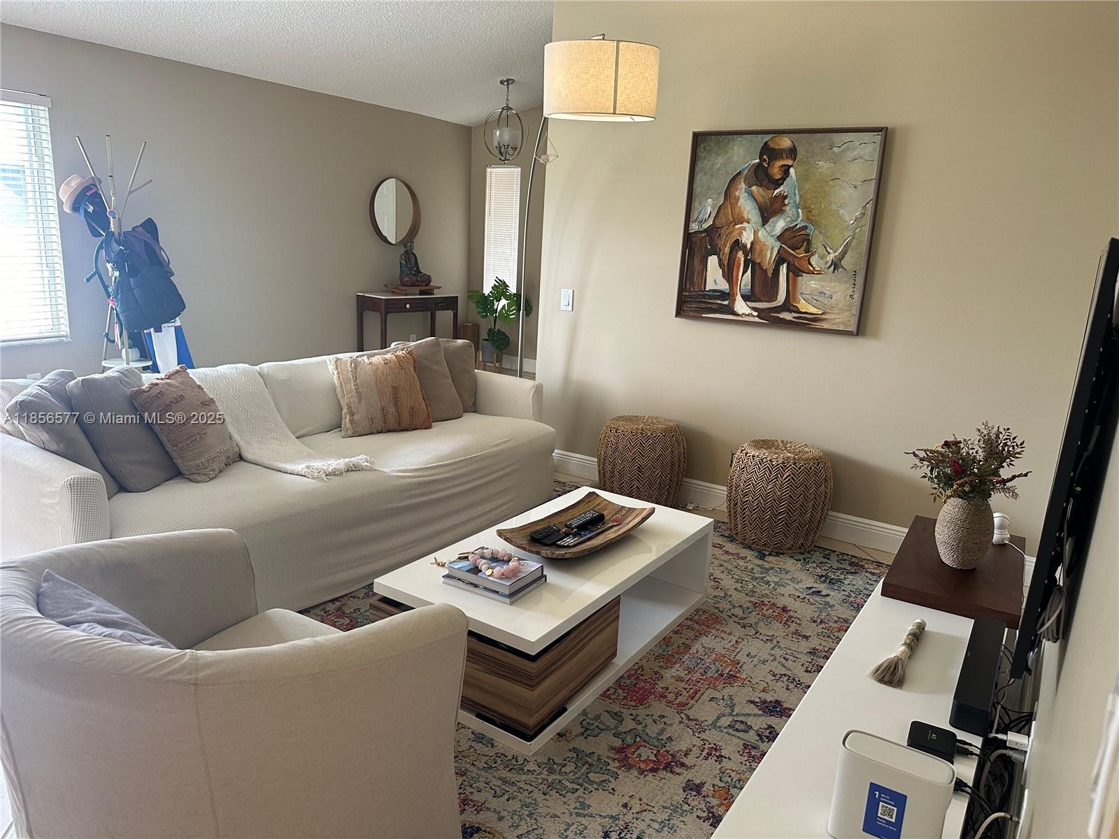 4370 Pine Ridge Court Weston, FL 33331 - Photo 7 of 39 a living room with furniture and a rug