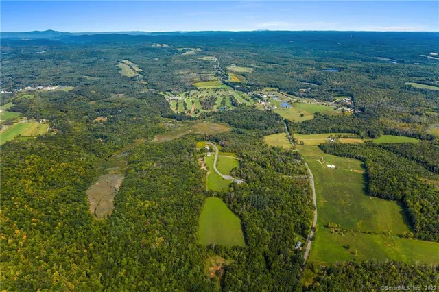 a view of a field with an ocean