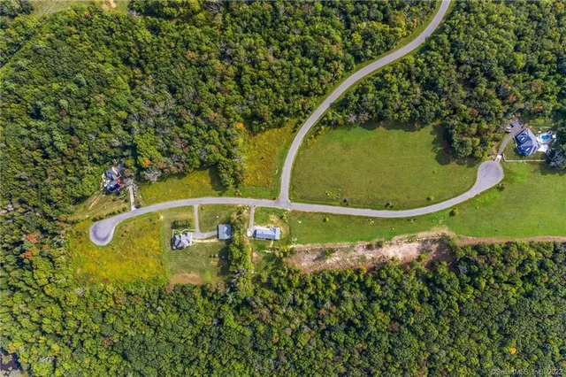 a view of a field with an ocean