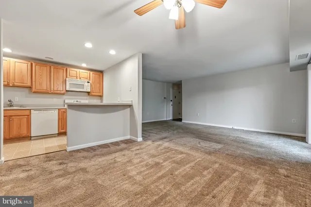 a view of a kitchen with a sink cabinets and a window