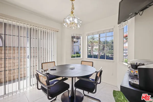 a view of a dining room with furniture and window
