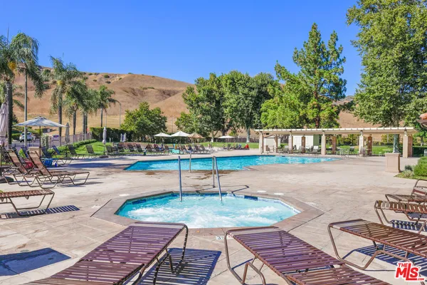 a view of a swimming pool with a lounge chairs