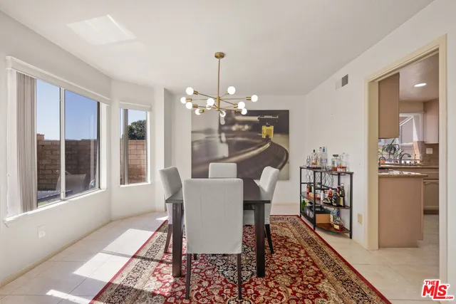 a view of a dining room with furniture and window