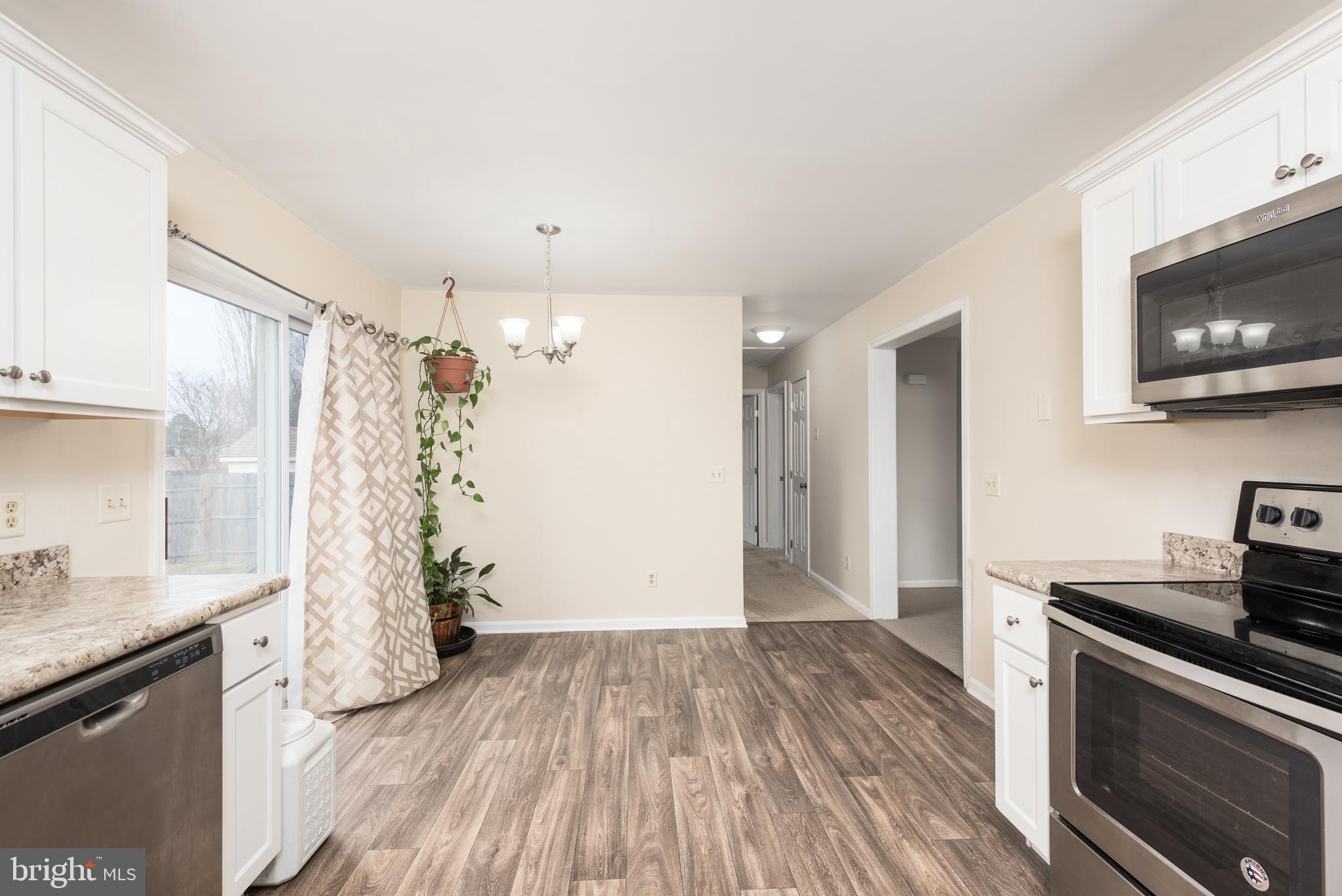 1 Oakview Court Ridgely, MD 21660 - Photo 11 of 26 a kitchen with a sink and a stove top oven