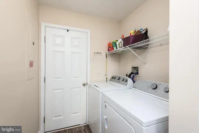 a bathroom with a sink a toilet and shower curtain