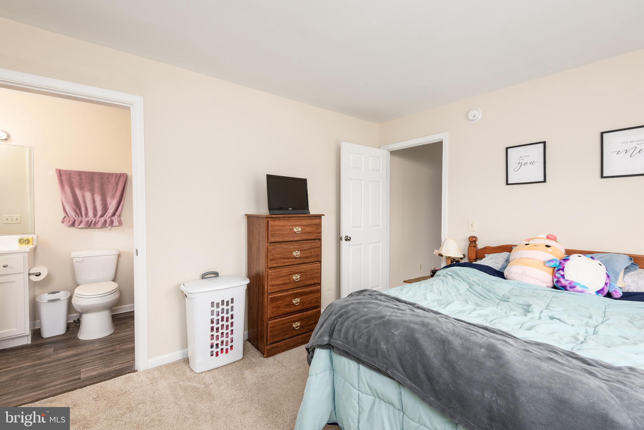 1 Oakview Court Ridgely, MD 21660 - Photo 17 of 26 a bedroom with a bed and a view of bathroom