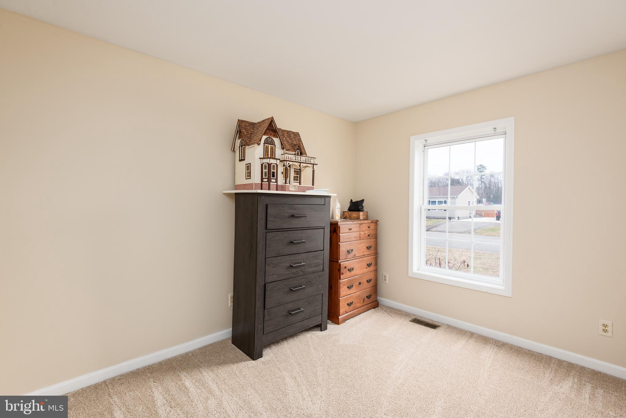 1 Oakview Court Ridgely, MD 21660 - Photo 21 of 26 a view of a bedroom with cabinet and window