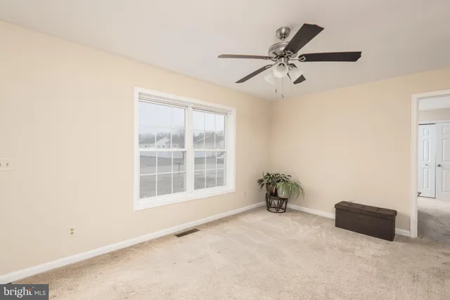 a kitchen with a sink a microwave a refrigerator and cabinets