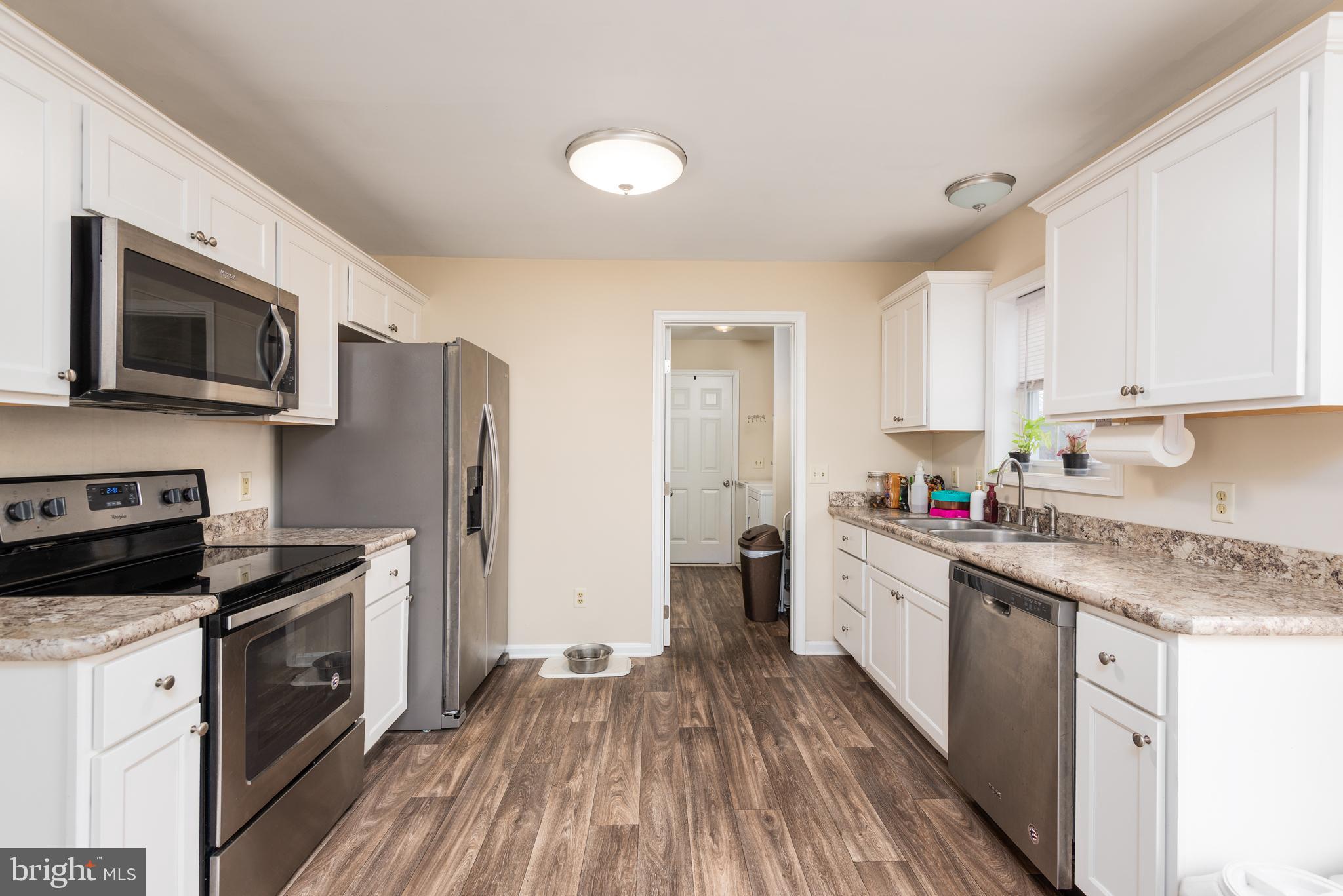 1 Oakview Court Ridgely, MD 21660 - Photo 10 of 26 a kitchen with a sink stove top oven and refrigerator