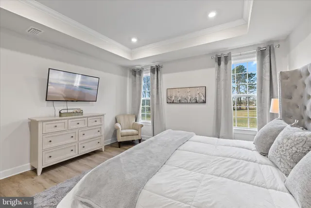 a large bathroom with a double vanity sink a large mirror a shower and a bathtub