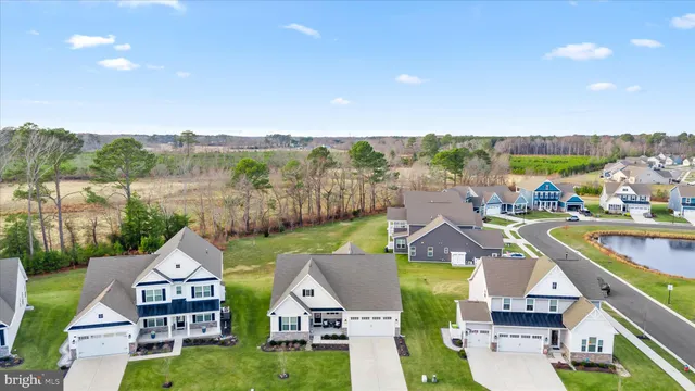 an aerial view of a swimming pool with seating area